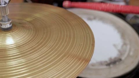 Red drumstick hitting the hi-hat cymbal Stock Footage 170485848