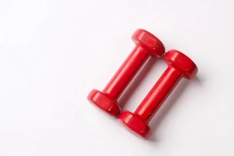 Red dumbbells for exercise and strength training Fotos Stock
