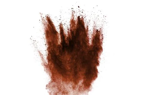 Red dust particles explosion on white background.Red sand splash. Stock Photos