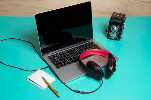 Red earphone on a notebook Stock Photos
