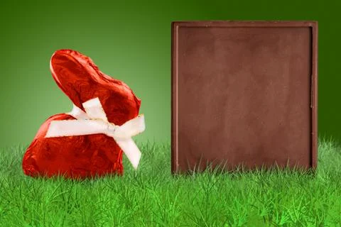 Red Easter bunny and chocolate board Stock Photos