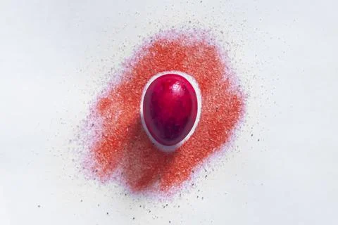 Red easter egg with color spread Stock Photos