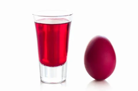 Red easter egg with a glass of drink Stock Photos