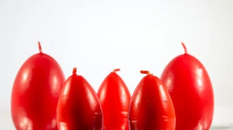 Red easter egg shape candles burning Stock-Footage 47795994