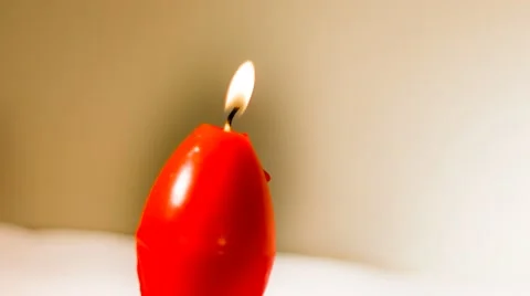 Red easter egg shape candles burning Stock-Footage 48284362