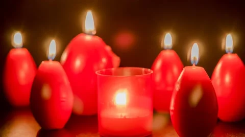 Red easter egg shape candles burning Video stock 48492427