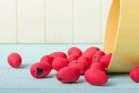 Red easter eggs on blue and yellow background Stock Photos