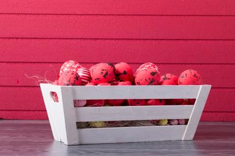 Red Easter eggs in a wooden container Stock Photos