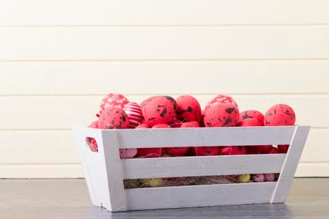 Red Easter eggs in a wooden container Stock Photos