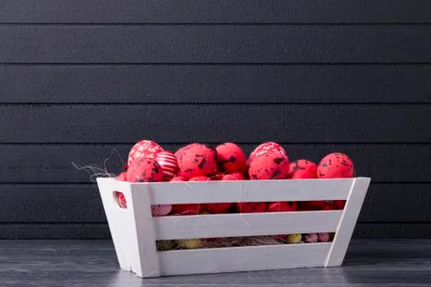 Red Easter eggs in a wooden container Stock Photos