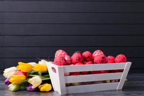 Red Easter eggs in a wooden container Stock Photos