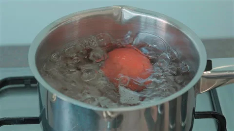 Red egg boils in metal pot Stock Footage 337653132