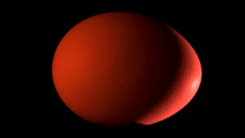 Red egg rotates on black background Stock Footage 104746264