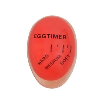 Red egg timer for measuring boiling levels on white background. Kitchen too.. Stock-Fotos