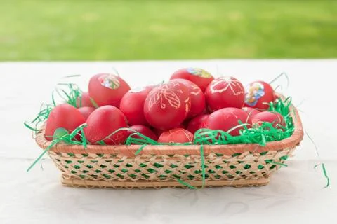 Red eggs in basket as decoration for Easter Stock Photos