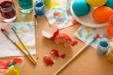 Red eggshell on the wooden table. Stock Photos
