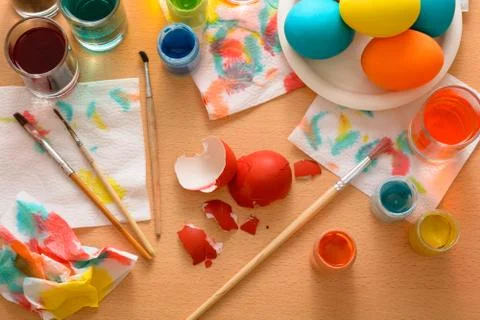 Red eggshell on the wooden table. Stock Photos