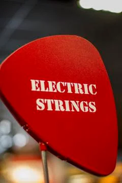 Red "Electric Strings" Sign Stock Photos
