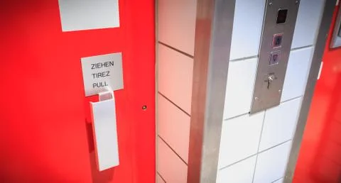 Red elevator door where it is written pull Stock Photos