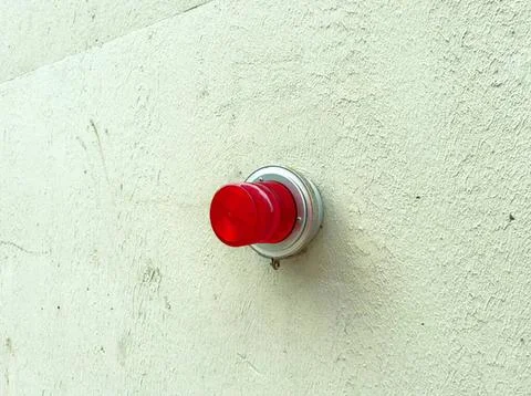 Red emergency alarm button on a wall Stock Photos