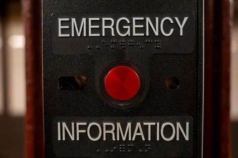 Red Emergency and Information button in NYC subway station. Stock Photos