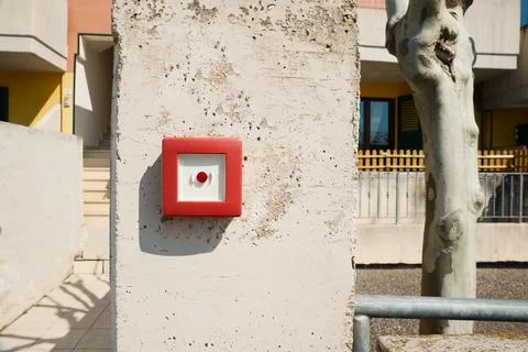 Red emergency button on stone pillar outdoors Stock Photos