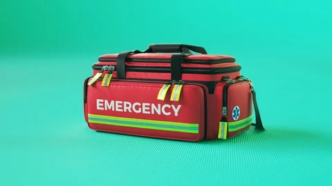 The red emergency first aid bag in colorful studio light. Paramedic kit. 4KHD Stock Footage 112600447