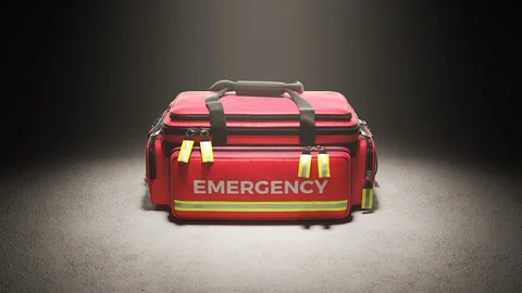 The red emergency first aid bag in the studio spotlight. Paramedic kit. 4KHD Stock Footage 112601549