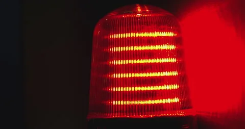 Red emergency rotating light flashing on dark background Stock Footage 313065148