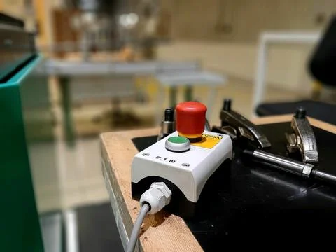 Red-emergency-stop-button-factory-photo-01 Stock Photos