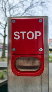 Red emergency stop button on metal post, safety pull handle, outdoor device Fotos Stock