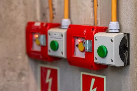 Red emergency stop buttons on the wall. Safety devices connected to the ele.. Stock-Fotos