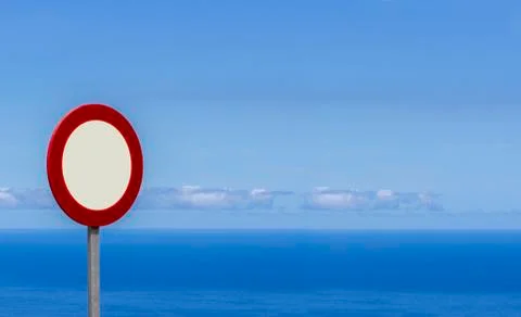 Red empty sign on the perfect background from blue sea and sky. 写真素材