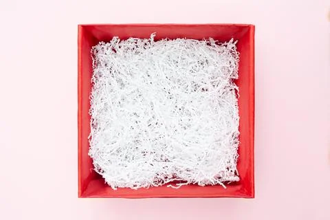 Red empty square box isolated on pink background. Flat lay. Top view. Festive Stock Photos