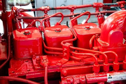 A red engine with three red cylinders Stock Photos