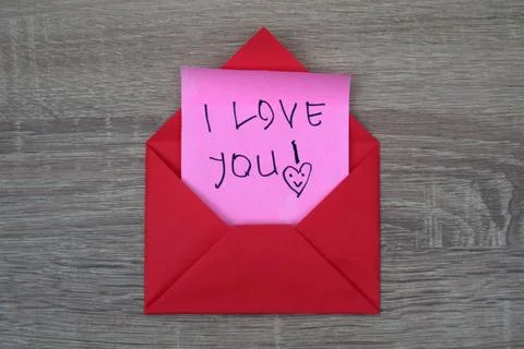 A red envelope containing the words I love you Stock Photos