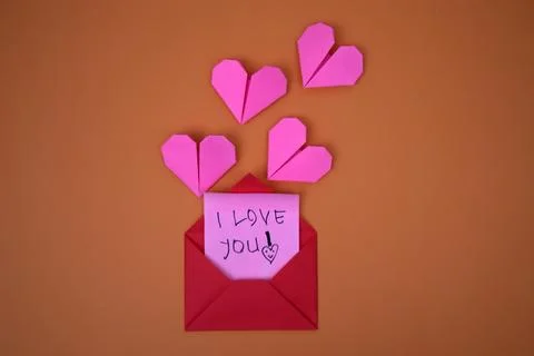 A red envelope containing the words I love you Stock Photos