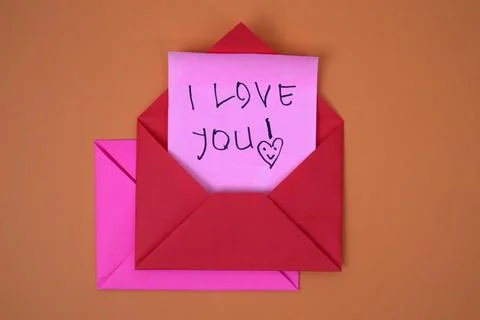 A red envelope containing the words I love you Stock Photos