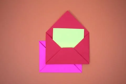 Red envelope on orange background Stock Photos