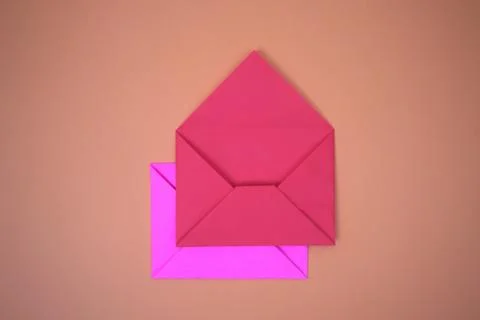 Red envelope on orange background Stock Photos