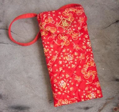 Red envelope with red cloth is soft in the background..wood Stock Photos