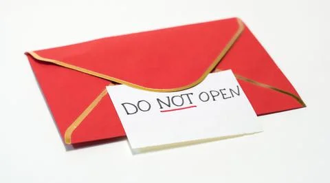 Red envelope with warning note saying "DO NOT OPEN" on white background Foto stock