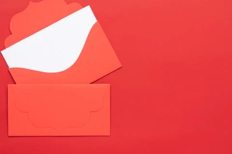 Red envelope with white letterhead inside. On the red background. Stock Photos