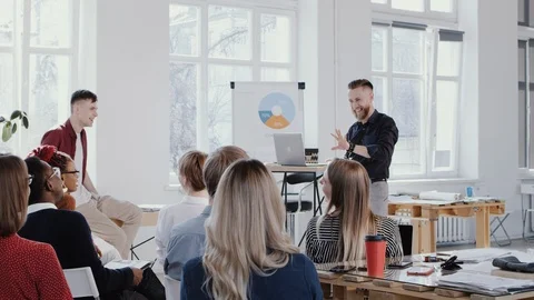 RED EPIC Happy middle aged male business coach expert speaking at modern office Video stock 114600577