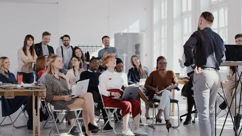 RED EPIC Happy middle aged male finance expert motivating workers at modern Video stock 114605340