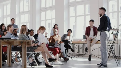 RED EPIC Middle aged coach businessman leading interactive seminar for Stock Footage 114603233