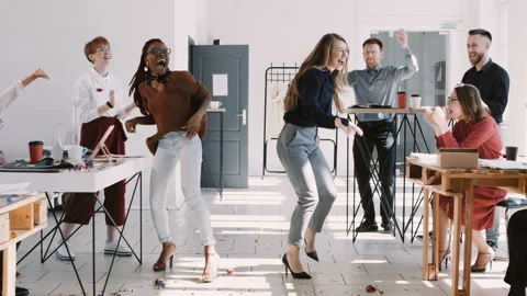 RED EPIC-W Happy young multiethnic female colleagues celebrate success with team Stock Footage 113076482