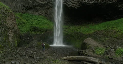 RED Epic- Waterfall with Hiker Video stock 141953602