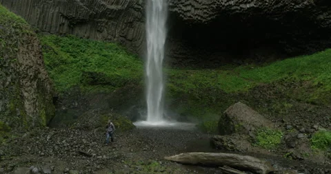 RED Epic- Waterfall with Hiker Stock Footage 142276452