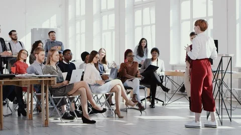 RED EPIC Young successful creative coach business woman sharing experience at Video stock 114610871